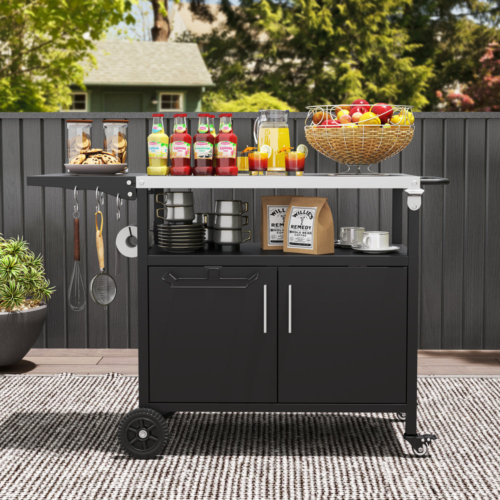 Outdoor grill cart with a folding stainless steel top, featuring storage, wheels, and accessories for outdoor parties.