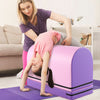 Gymnastics vaulting box in purple with detachable mat, used for training by kids aged 3-10 in a home setting.