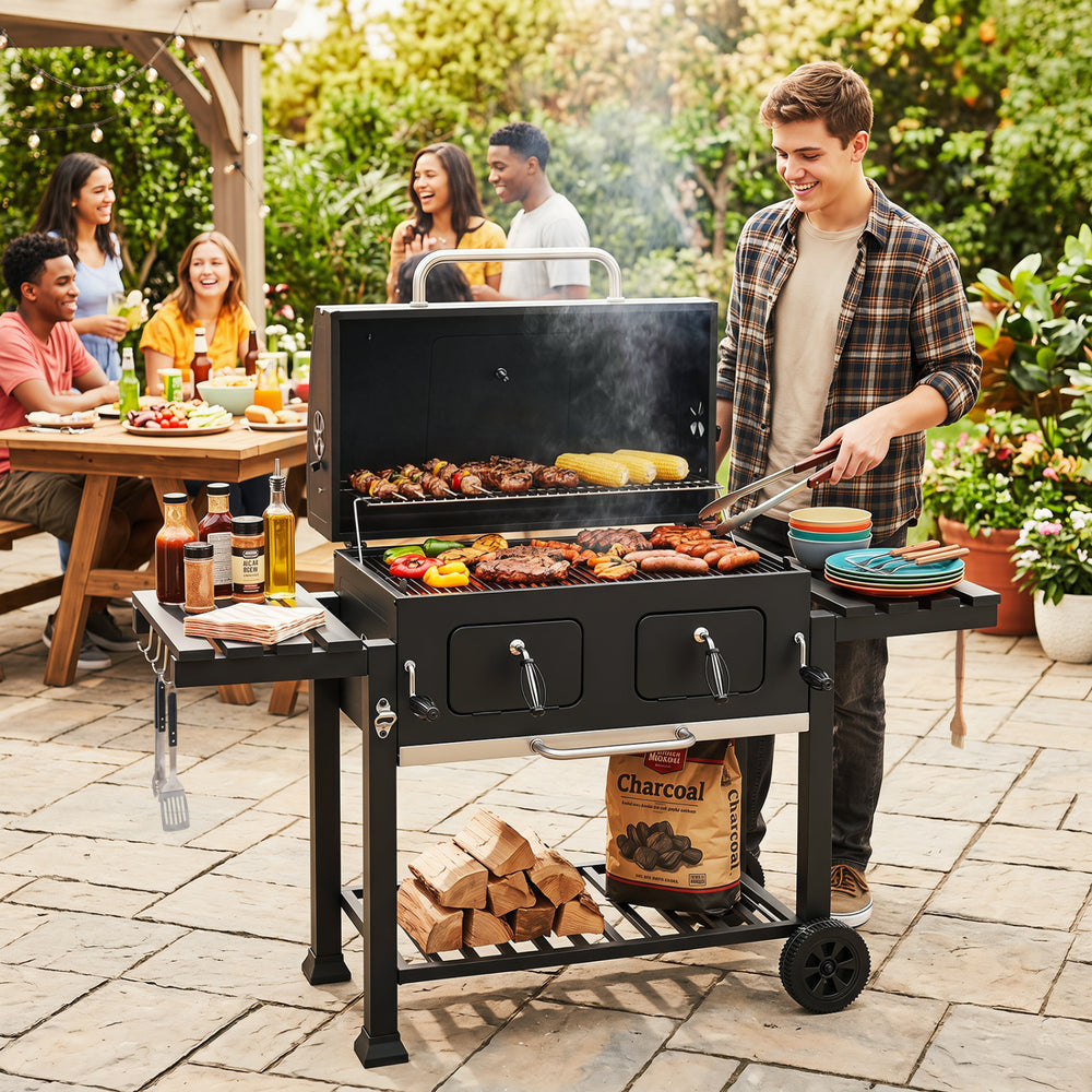 Large charcoal grill with integrated bottle opener and easy-to-grip handles, ideal for outdoor barbecue preparation.