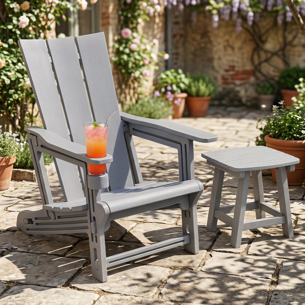 Gray HDPE outdoor Adirondack chair with a cup holder and slatted seat, perfect for comfortable relaxation in any outdoor space.