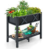 Elevated black HIPS raised garden bed with plants, featuring a slatted shelf for gardening accessories and drainage.