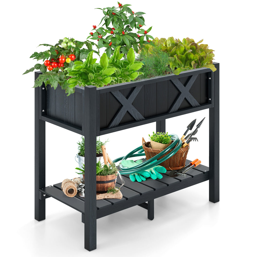Elevated black HIPS raised garden bed with plants, featuring a slatted shelf for gardening accessories and drainage.