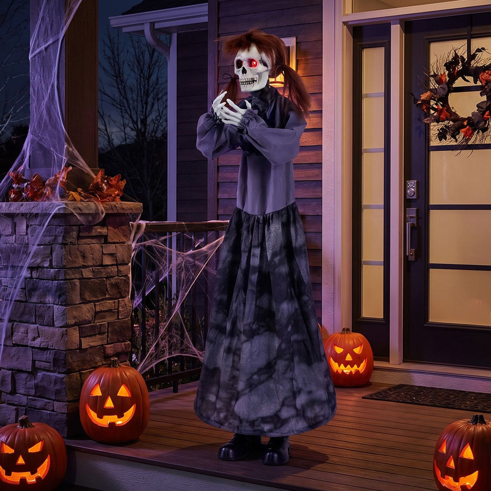 Halloween animatronic jumpscare doll features a pop-up head, glowing eyes, and posable arms for spooky decorations.