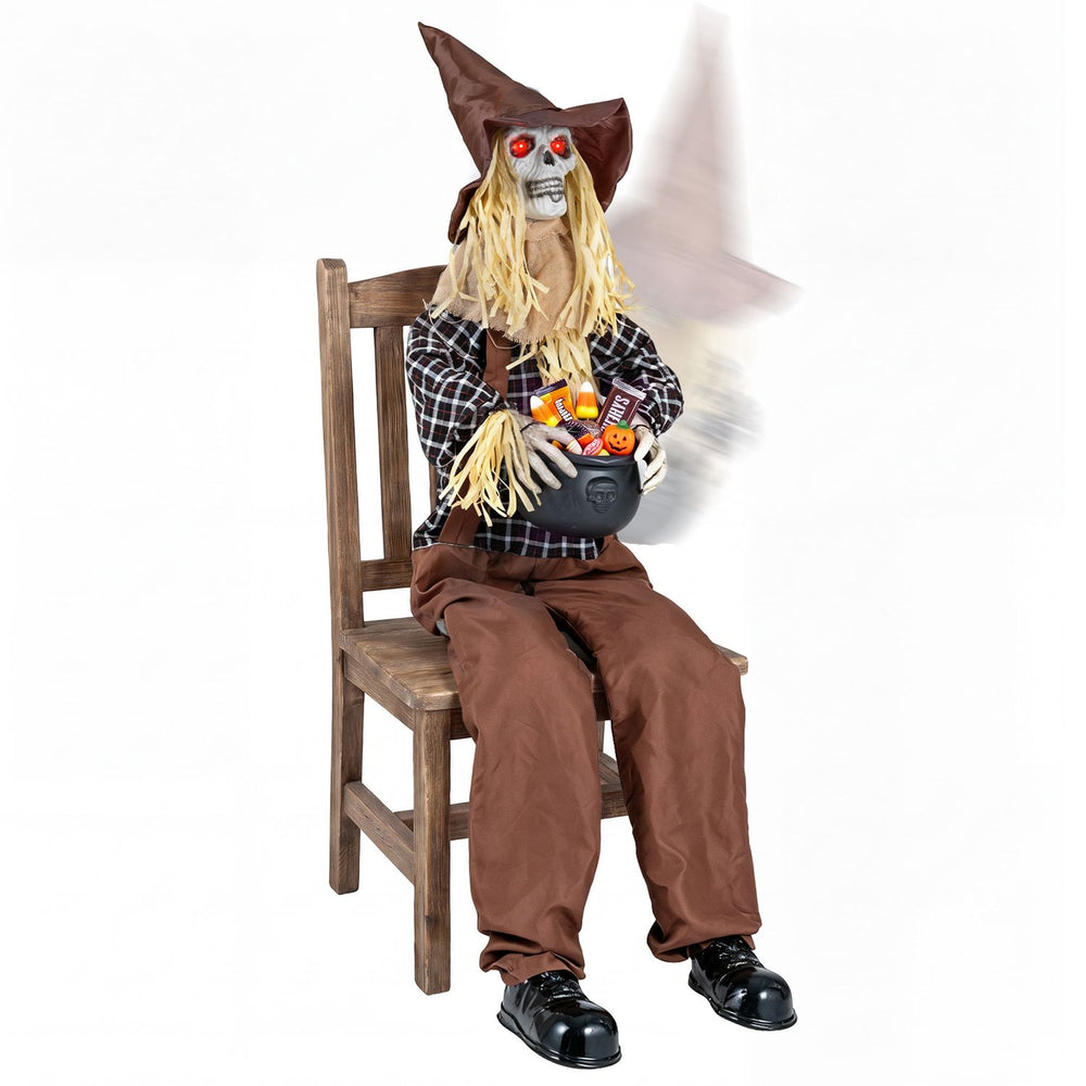 Eerie Halloween animatronic sitting scarecrow with glowing red eyes, candy bowl, and sound-activated spooky features.