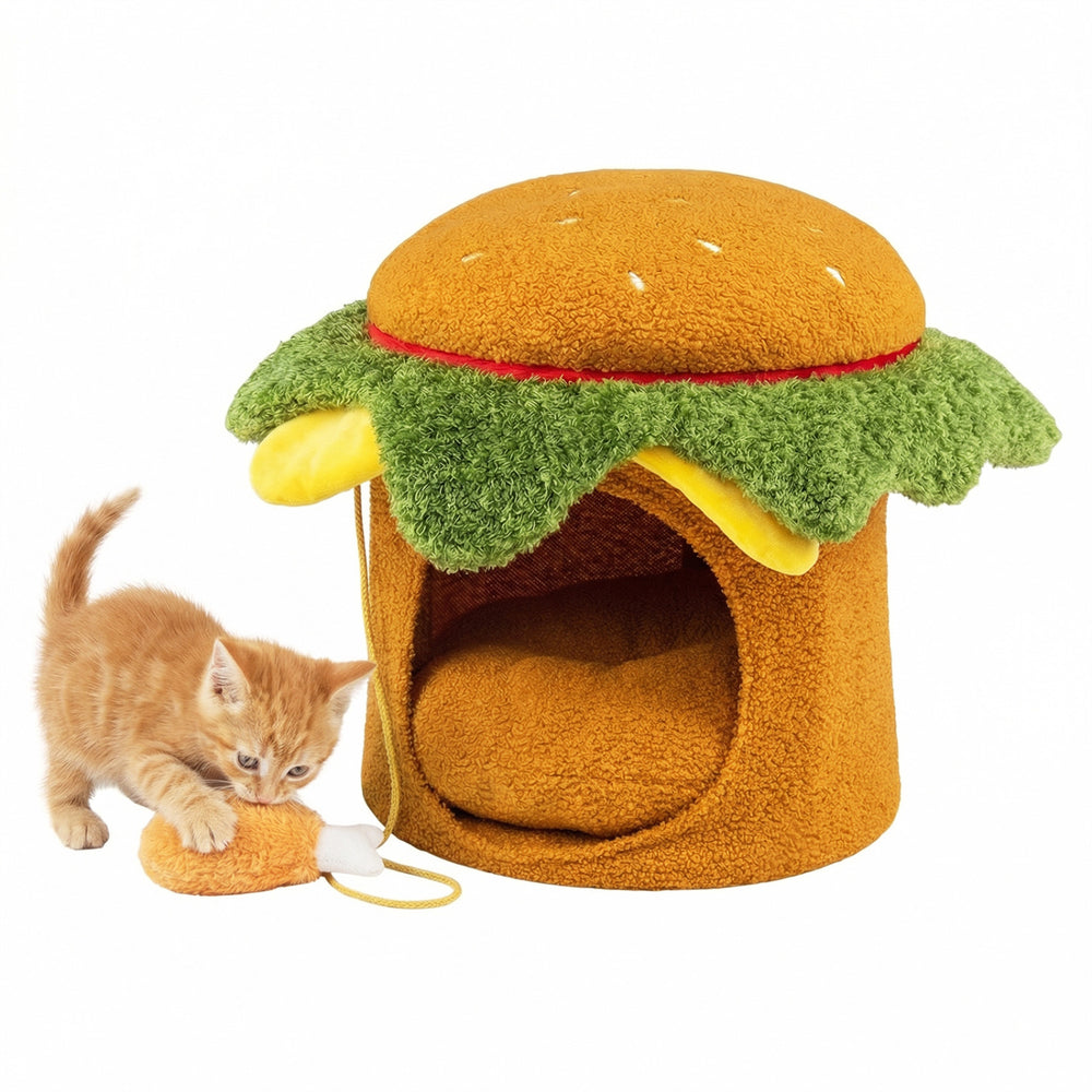 Hamburger-shaped cat nest with removable cushion and plush chicken drumstick toy for indoor cats' comfort and play.