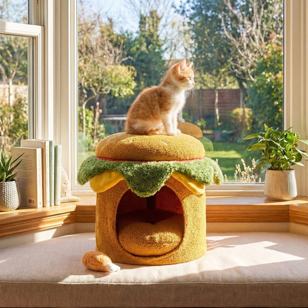Elevated hamburger cat nest in yellow, featuring a plush chicken drumstick toy and soft removable cushion for indoor.