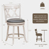 Hand-antiqued swivel stool with wider padded seat, X-shaped back, and decorative rivets for kitchen or pub use.