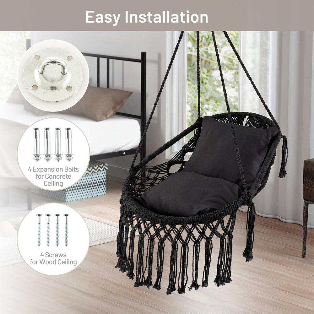 Hanging hammock chair in black with soft cushions, tassels, and sturdy rope chain, ideal for indoor or outdoor use.