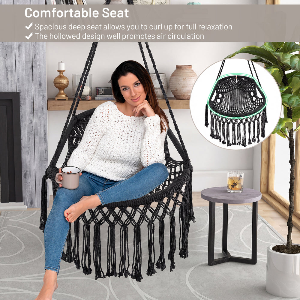 Hanging hammock chair with soft cushions, sturdy rope chain, and elegant tassels, perfect for indoor and outdoor.