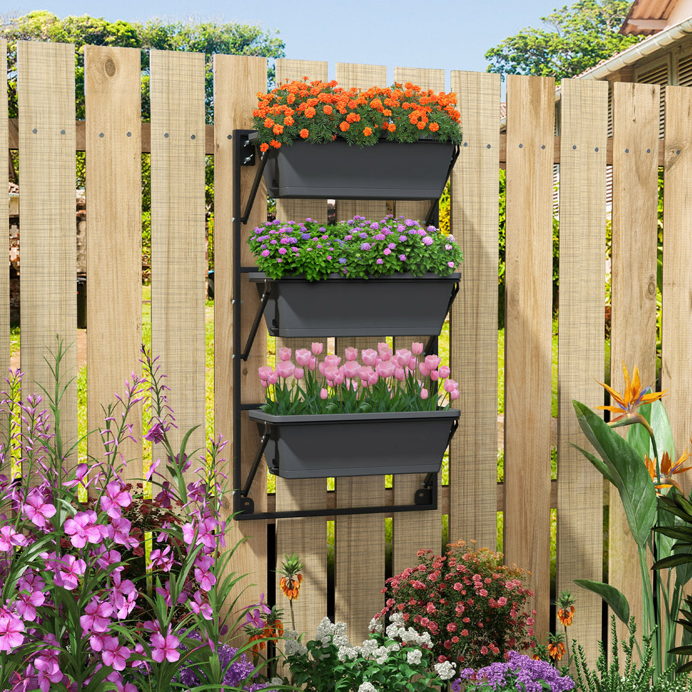 Vertical wall-mounted planter with three detachable boxes, adjustable height, and drainage holes for optimal airflow.