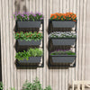 Hanging vertical planter with three detachable black boxes, adjustable height, mounted on a wooden wall for.