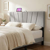 Geometric gray upholstered headboard for queen and full size beds with USB and AC outlets for convenient charging.