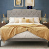 Rivet tufted gray upholstered headboard for queen and full size beds, featuring USB and Type-C ports for device.