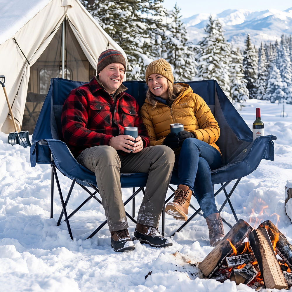 Heated double camping chair in navy showcases a sturdy frame, soft padding, and wine glass holders for cozy outdoor relaxation.