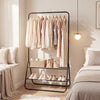 Heavy duty black clothes rack with hanging rod and two storage shelves, ideal for bedroom or laundry room organization.