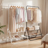 Heavy duty black clothes rack showcasing a side view with hanging rod and two shelves for shoes and accessories.