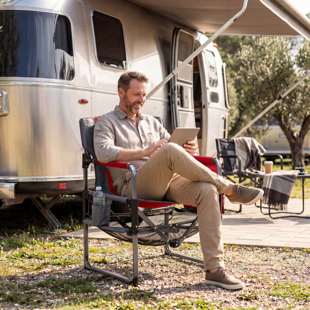Heavy-duty outdoor camping chair in red with cup holder and side pocket, perfect for relaxation at the campsite.