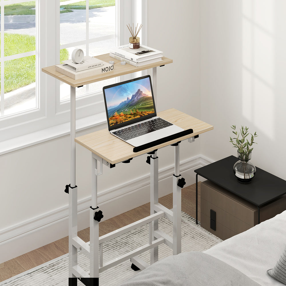 Height-adjustable mobile standing desk with split top, ergonomic design, and casters for easy mobility in a home office.