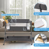 Height adjustable bedside sleeper in gray with breathable mesh, soft mattress, and storage bag for baby essentials.