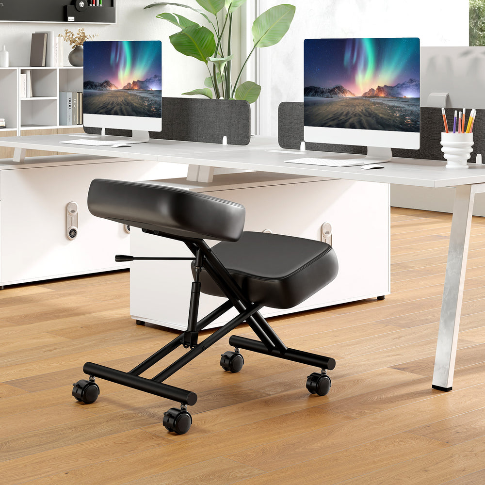 Height adjustable kneeling chair with padded cushion and black faux leather, ideal for posture correction in an office.
