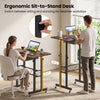 Height adjustable laptop desk in rustic brown with fabric drawer, lockable wheels, and ergonomic sit-to-stand design.
