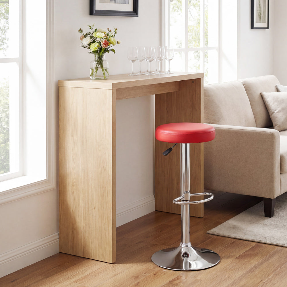 Height-adjustable red bar stool with 360° swivel and sturdy metal frame, perfect for modern kitchens and dining areas.