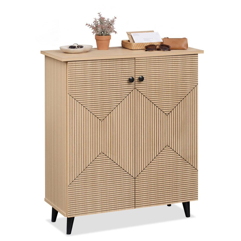 Freestanding geometric cabinet with carved panels, featuring two doors and ample storage for footwear in a natural finish.