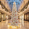 12 ft hinged artificial spruce Christmas tree featuring vibrant PVC leaves and warm white LED lights for a dazzling holiday look.