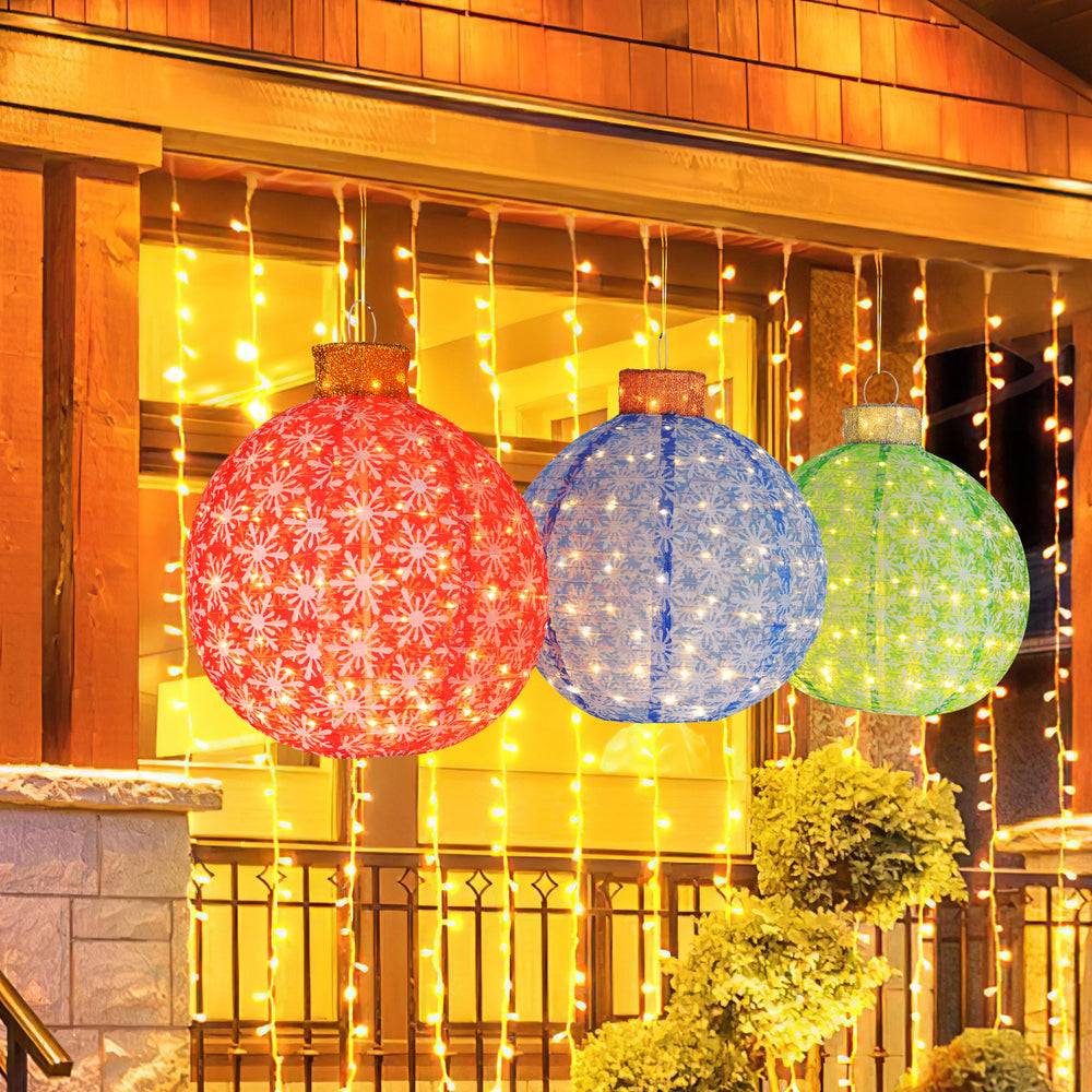 Three pre-lit Christmas balls in red, blue, and green with snowflake patterns, ideal for festive indoor and outdoor.