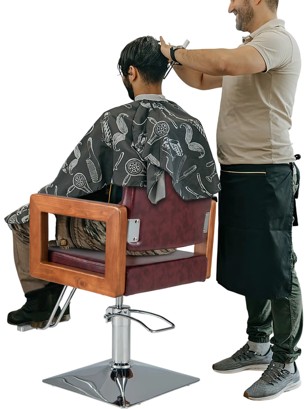 Hydraulic barber chair in red with 360-degree swivel, adjustable headrest, and high-density sponge padding for comfort.