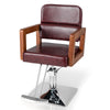 Hydraulic barber chair with red PVC leather, wooden armrests, and 360-degree swivel for hairstylist use.