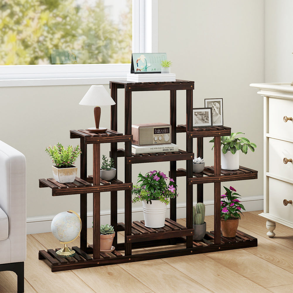 Multi-tiered brown wood plant stand showcasing 9 potted plants, ideal for indoor and outdoor use with a stable design.