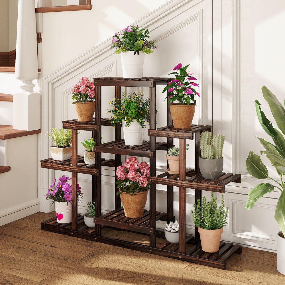 Multi-tiered brown wood plant stand with 6 shelves, displaying potted plants, ideal for indoor and outdoor use.