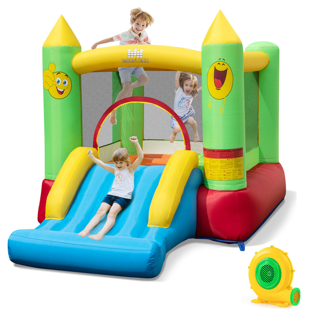 Smiley face inflatable bounce house with slide, basketball hoop, and 480W blower for outdoor fun and entertainment.