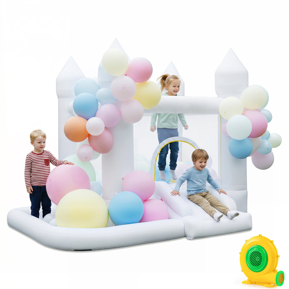 Inflatable bounce house with colorful balloons, slide, basketball hoop, and pit, perfect for outdoor parties and fun.