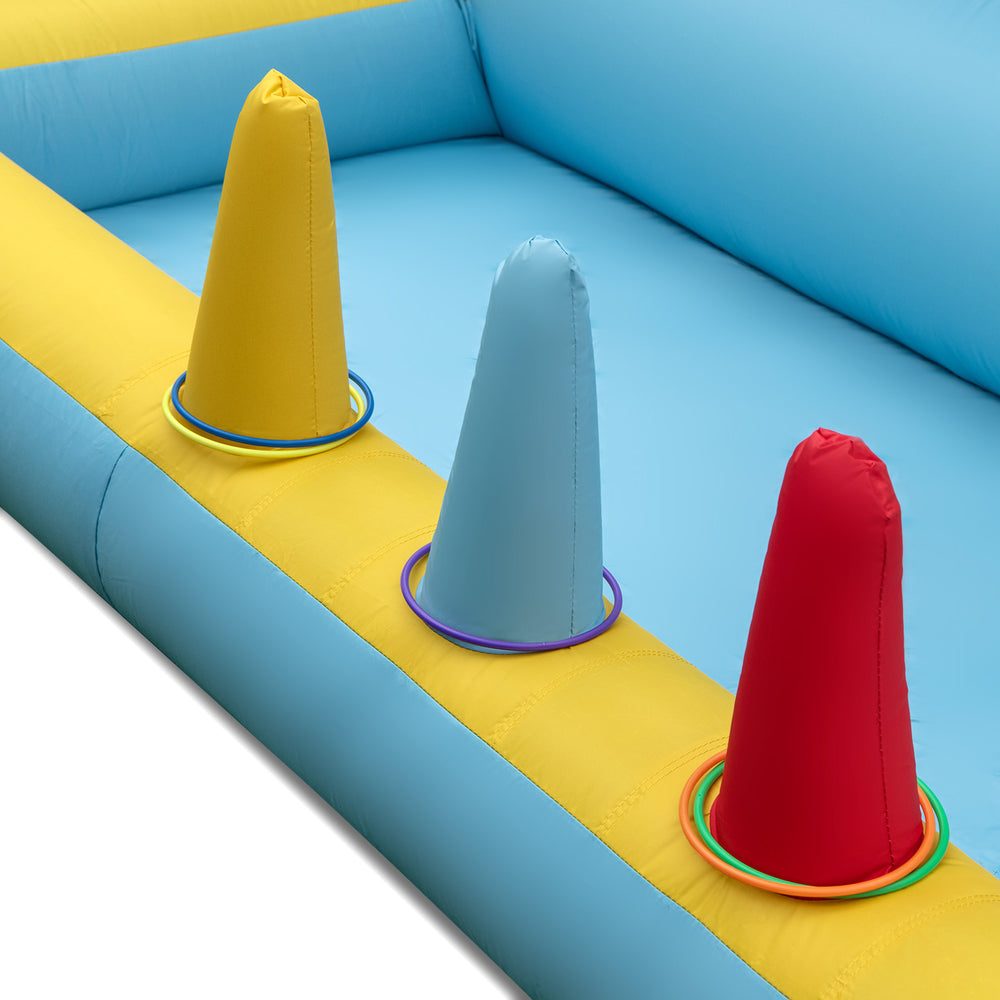 Inflatable bounce house with colorful cones and rings, featuring a slide and tunnel for kids' active play.