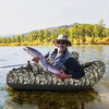 Inflatable float tube in camouflage with fishing rod holder, storage pockets, and a comfortable seat for fishing.
