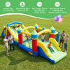 Inflatable obstacle course bounce house with dual slides and tunnels for kids' outdoor fun in the backyard.