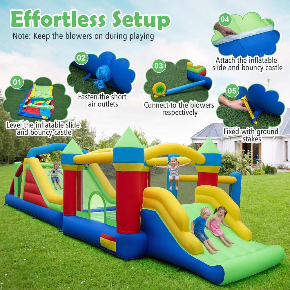 Inflatable obstacle course bounce house with dual slides, featuring a rock climbing wall and tunnels for kids' fun.