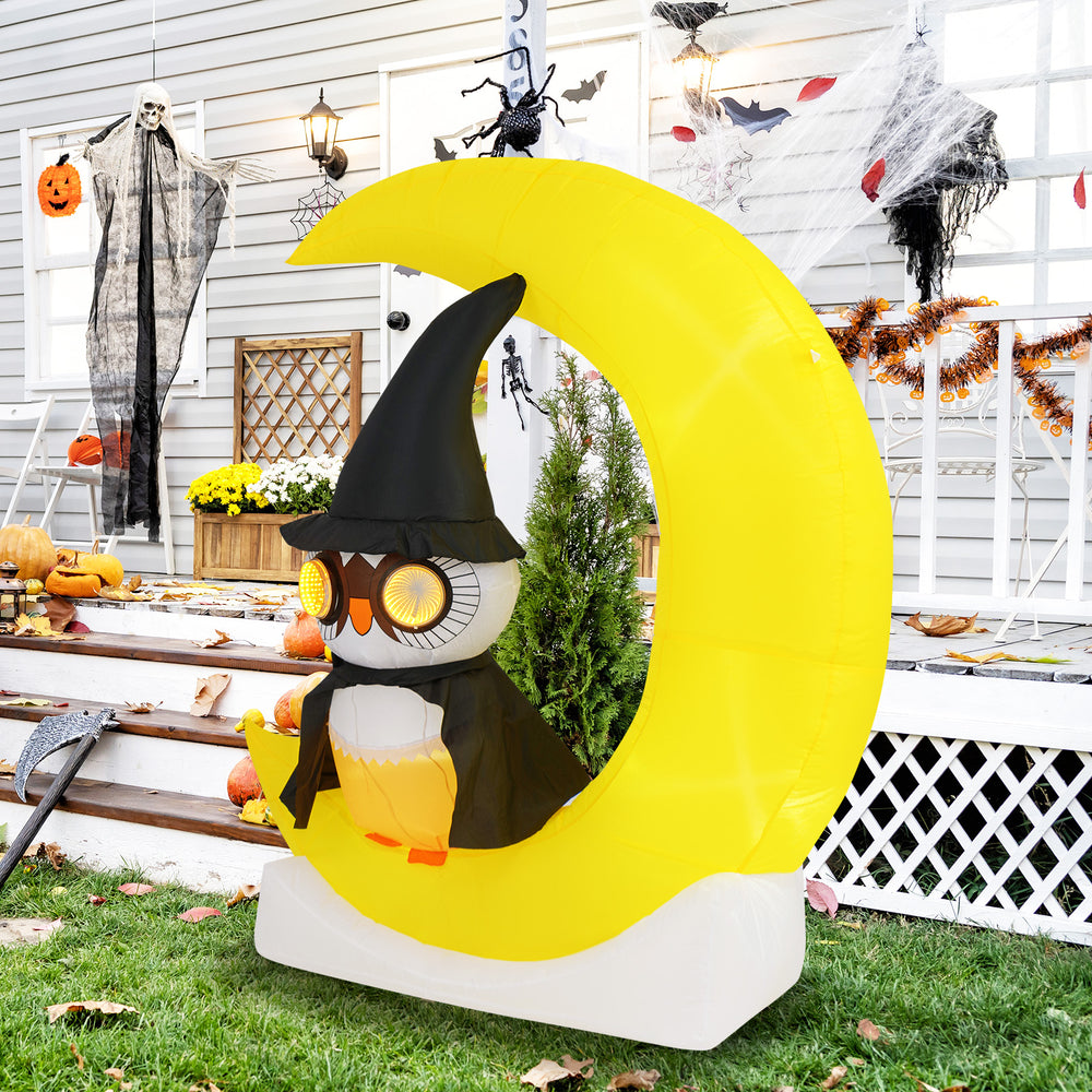Adorable inflatable owl on a crescent moon with LED lights, perfect for Halloween outdoor decoration.