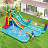 Giant inflatable water slide park featuring double slides, splash pools, and games for summer fun in the backyard.