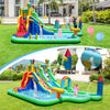 Giant inflatable water slide park with dual slides, splash pool, and climbing wall for backyard summer fun.