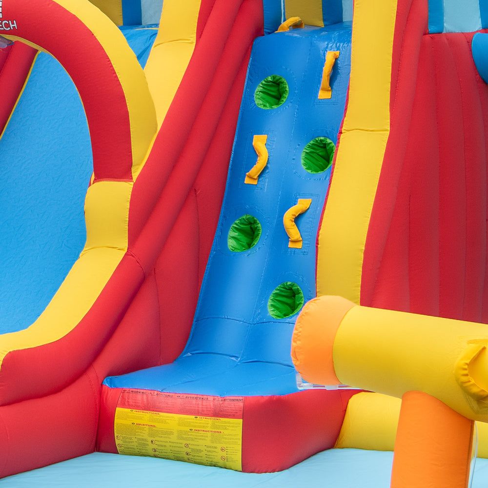 Bright inflatable water slide featuring a long slide, climbing wall, and splash pool, perfect for summer fun in the.