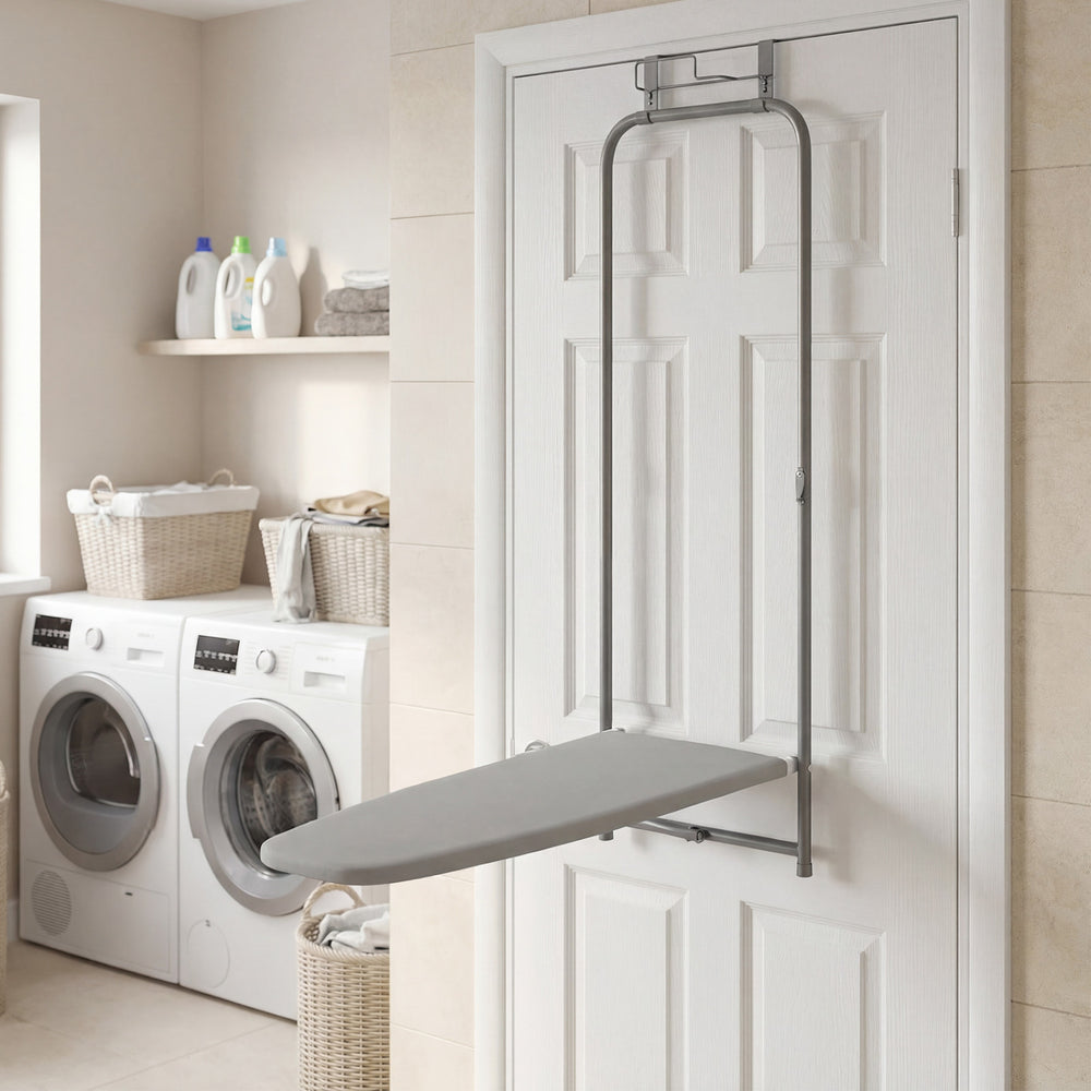 Space-saving gray metal hanging ironing board mounted on a door, ideal for laundry rooms and apartments.
