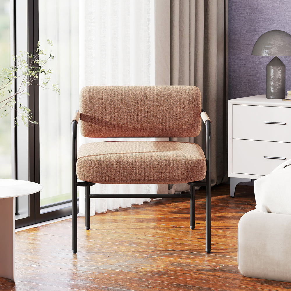 Brown velvet upholstered accent chair with cylindrical backrest and metal armrests, ideal for living room or reading.