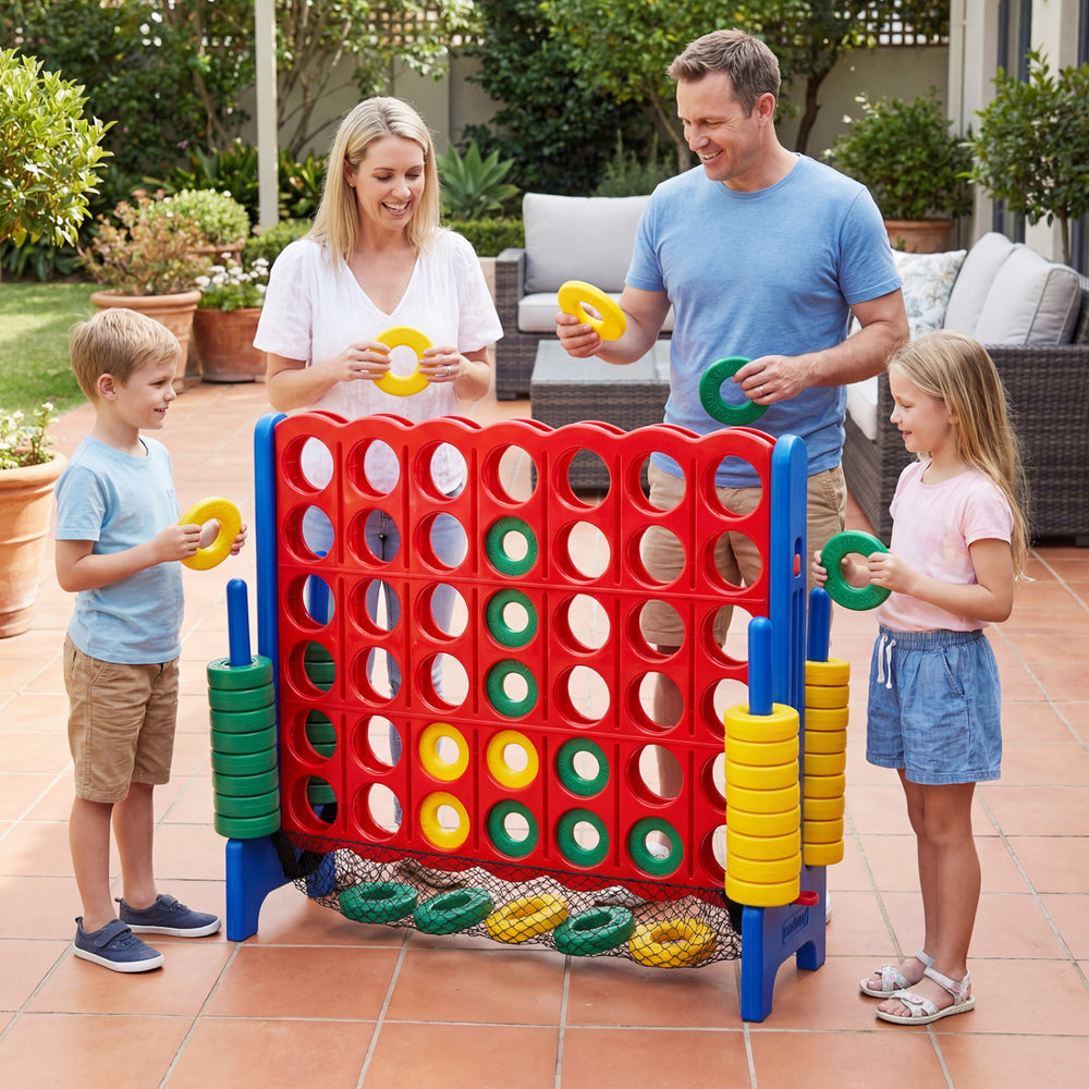 Jumbo 4 in a Row game set in red with family playing outdoors, featuring 42 chess pieces for fun and developmental play.