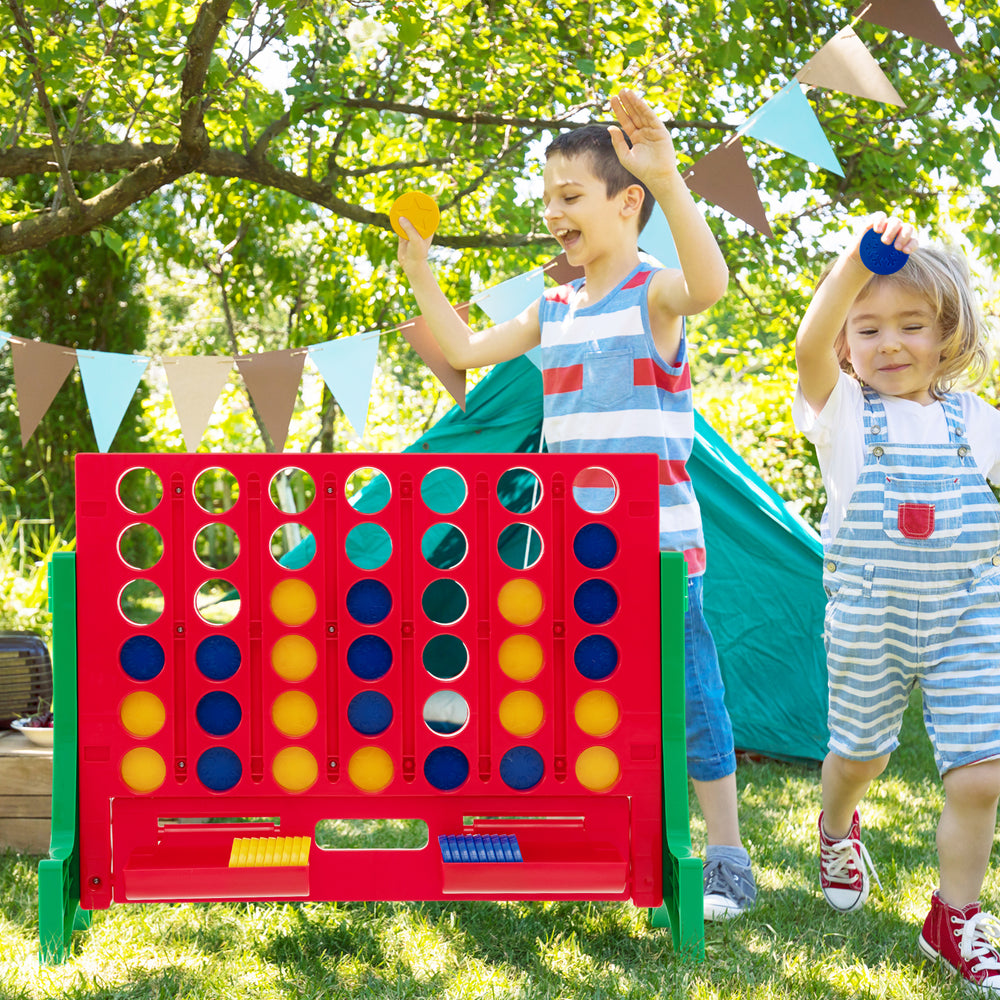 Jumbo 4-to-Score Connect Game Set in green, featuring kids playing outdoors with colorful coins for family fun.