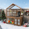 Kid's outdoor mud kitchen in natural wood with canopy, featuring sink, stove, and chalkboard for imaginative play.