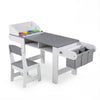 Kids art table and chair set in gray with paper roll dispenser and fabric bins for drawing and studying activities.
