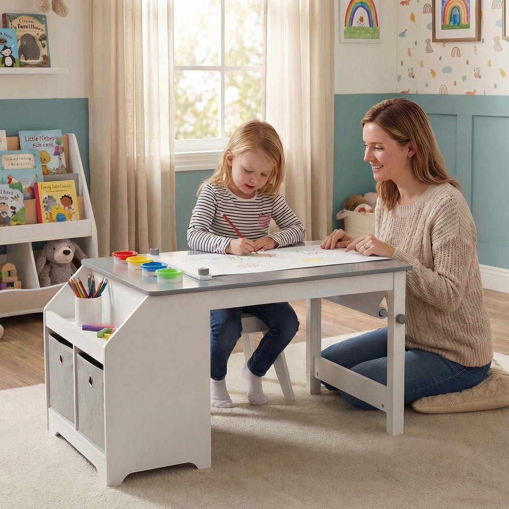Kids art table and stool set in gray with paper roll and paint cups, perfect for creative play in a nursery or playroom.